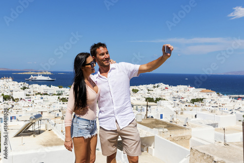 Young couple taking selfie in Mykonos