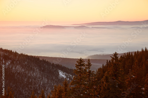 Golden sunset in the mountains, a vast fog over the valley © Castigatio