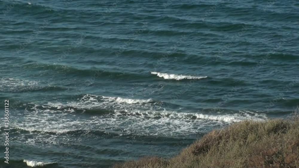 Coastline with embankments and approaching waves in sardinia, italy (high speed) Coastline with embankments and approaching waves in sardinia, italy (high speed)