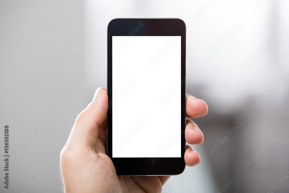 Hand Holding Cell Phone With Blank Screen Hand Holding Cell Phone With Blank Screen