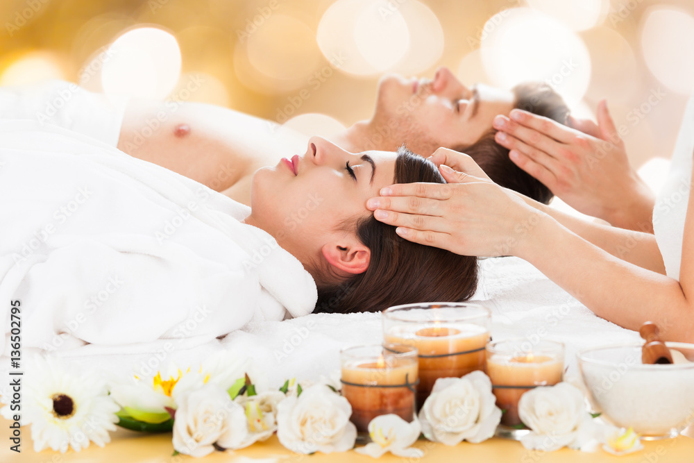 Couple Receiving Head Massage At Spa Couple Receiving Head Massage At Spa