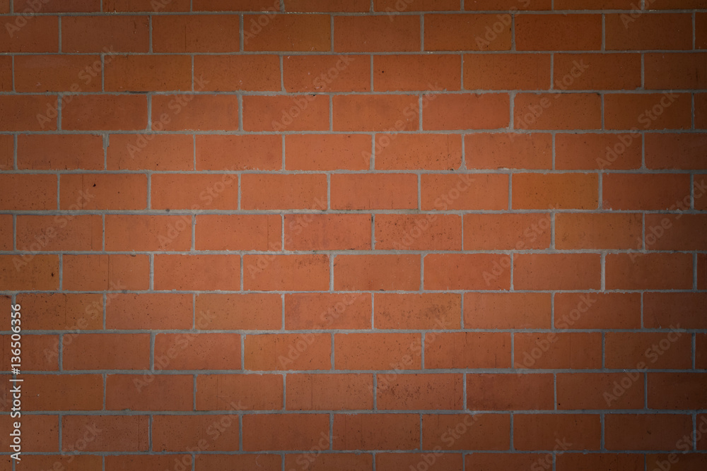 Obraz premium Spotlight on Orange Brick Wall