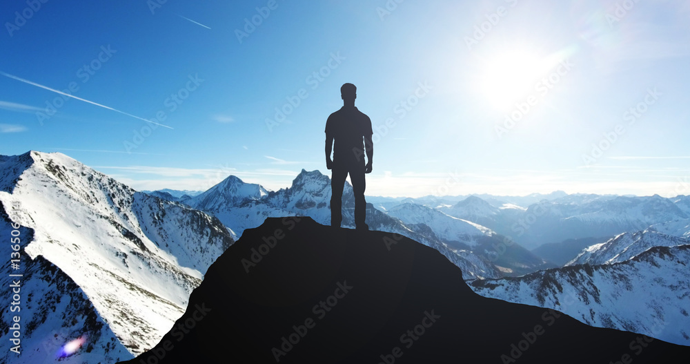 Silhouette Of A Man Standing On Mountain