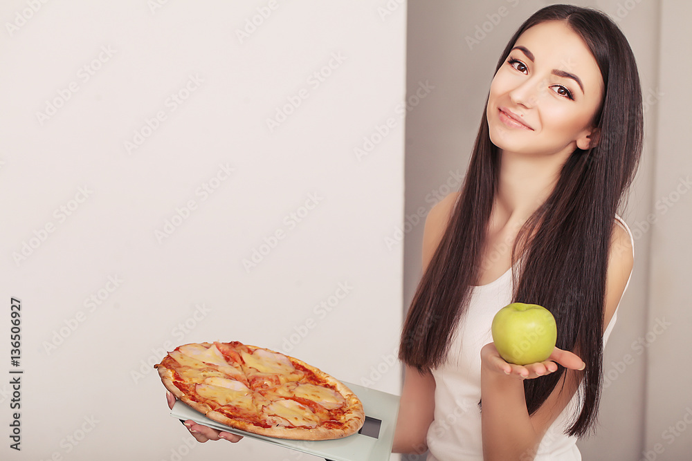 Diet And Fast Food Concept. Overweight Woman Standing On Weighing Scale Holding Pizza. Unhealthy Junk Food. Dieting, Lifestyle. Weight Loss. Obesity Diet And Fast Food Concept. Overweight Woman Standing On Weighing Scale Holding Pizza. Unhealthy Junk Food. Dieting, Lifestyle. Weight Loss. Obesity
