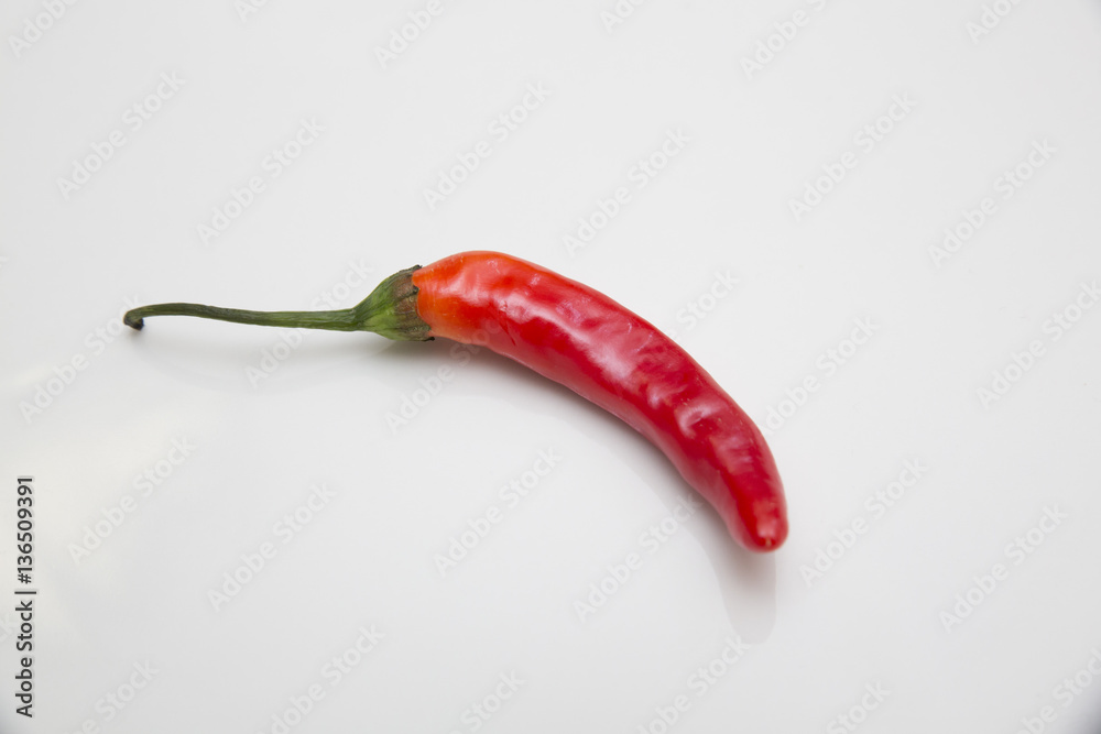 red chili peppers on white background red chili peppers on white background