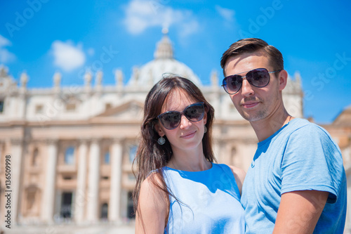 Happy couple at St. Peter's Basilica church in Vatican, Rome. The St. Peter's Basilica church is the main attractions © travnikovstudio
