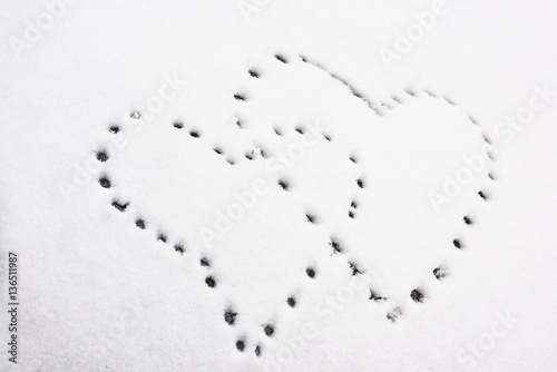 Shapes of heart on snow