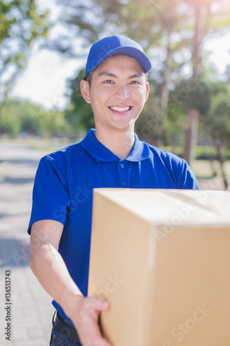 deliveryman stand and smile