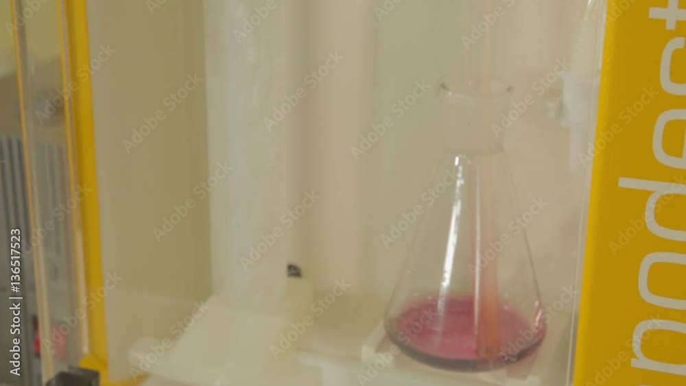 Test tube in scientist hand in laboratory Test tube in scientist hand in laboratory