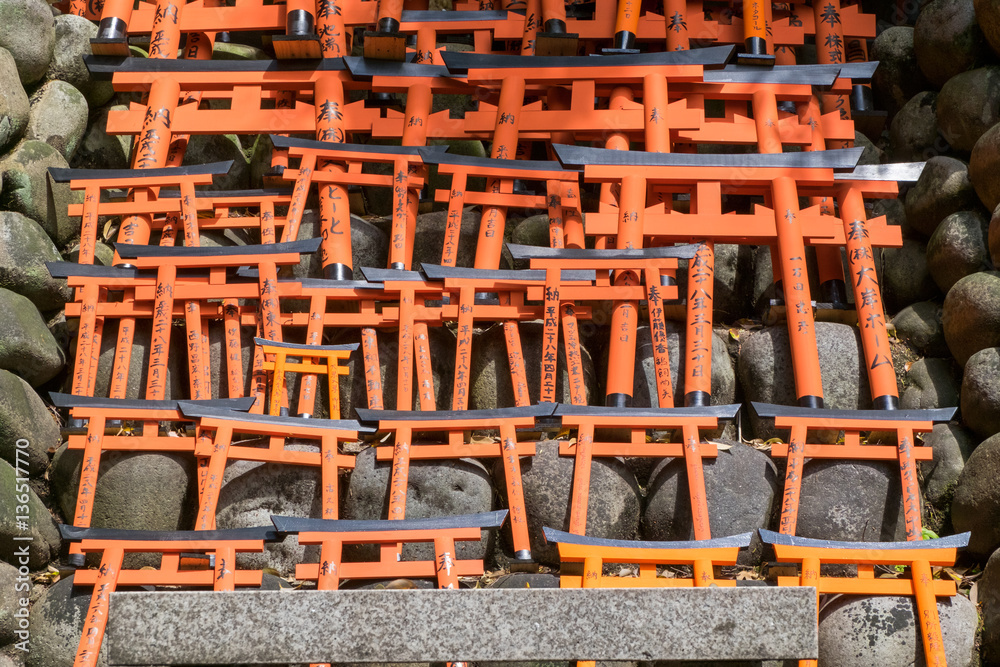 Small red torii gate at Fushimi Inari Shrine in Kyoto, Japan