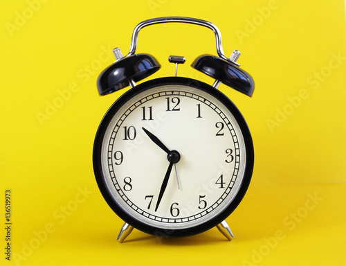 classic table clock on a yellow background. interior Features