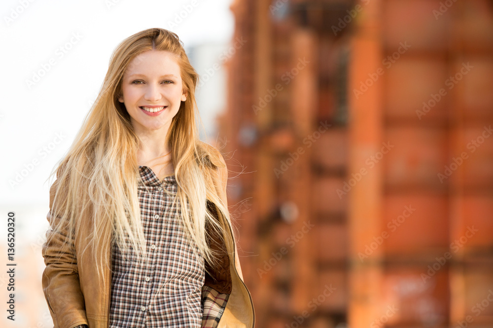 smiling happy young caucasian blond woman urban 