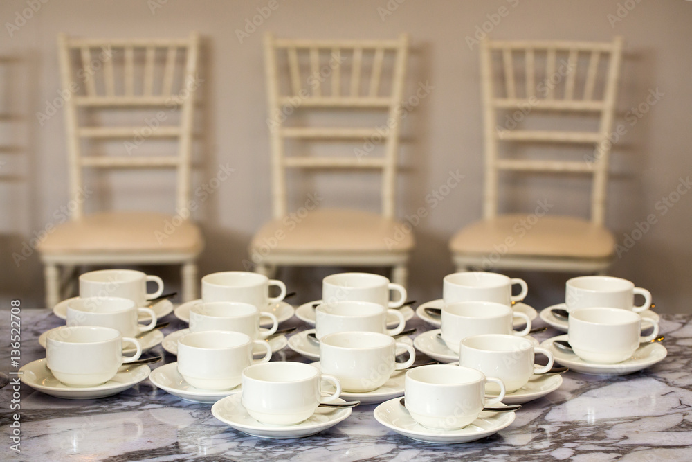 Coffee mugs on a table at a party. Coffee mugs on a table at a party.