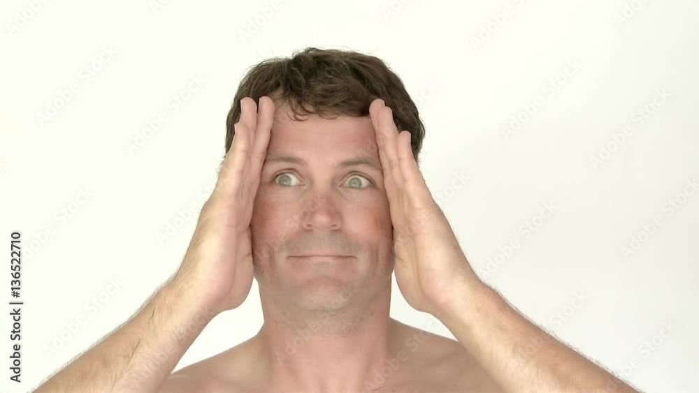 Model released man in studio with hands on his face shifting his eyes like a cuckoo clock. Captured in 4K. Model released man in studio with hands on his face shifting his eyes like a cuckoo clock. Captured in 4K.