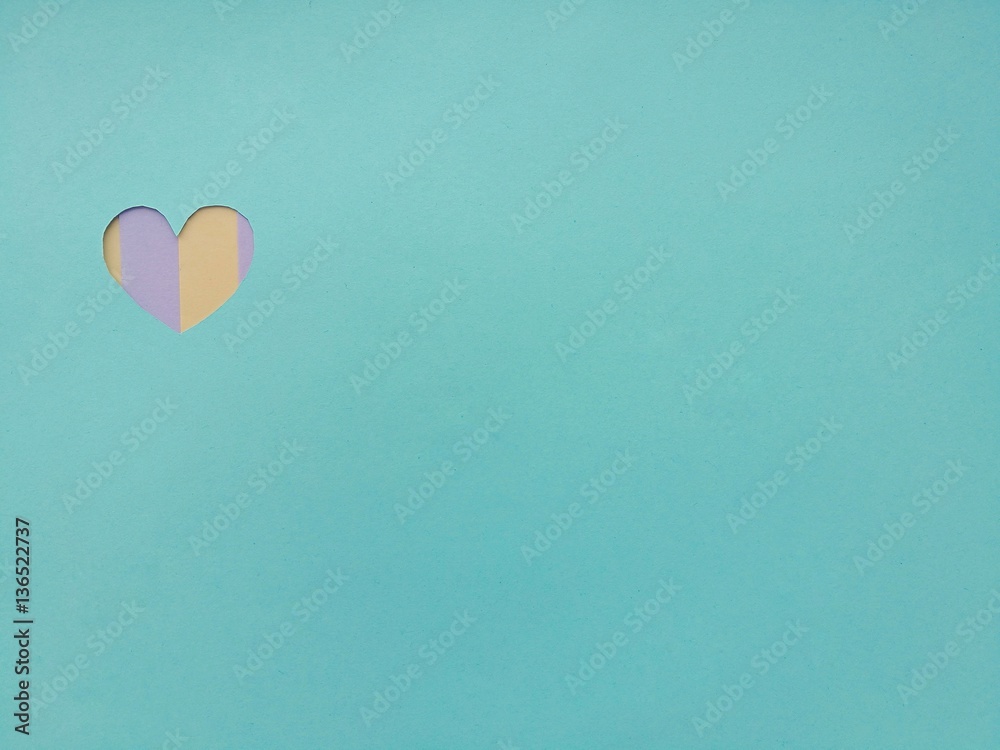 Love heart shape in colorful paper. Valentine concept on office stationary, abstract and vintage/pastel background