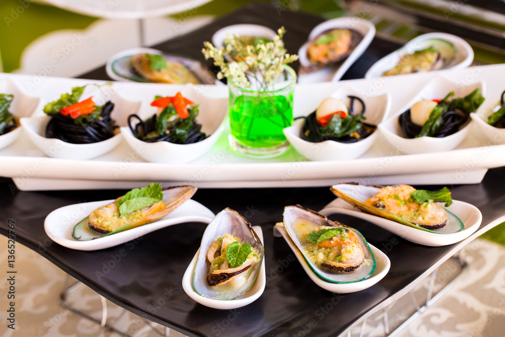 Steamed sea mussels. Large blue mussels on  plate