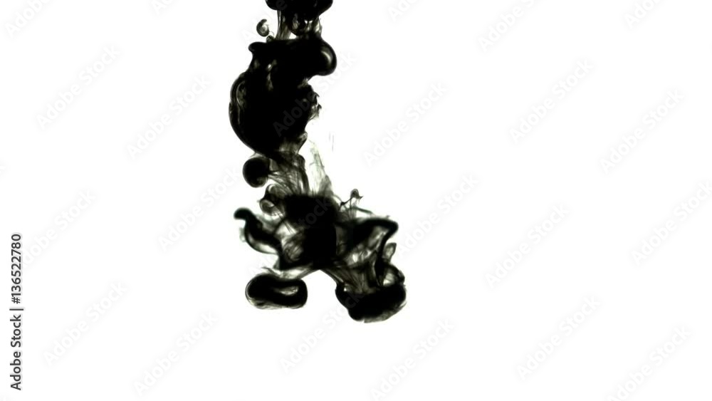Black inks in water 4K. A drop of black ink in water in slow motion 
