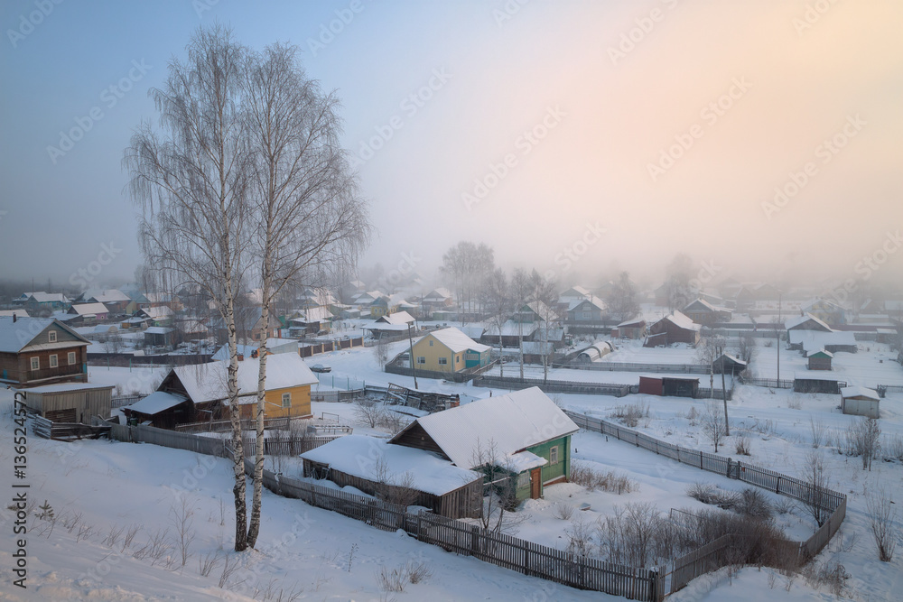 view of the village in the mist of a frosty morning