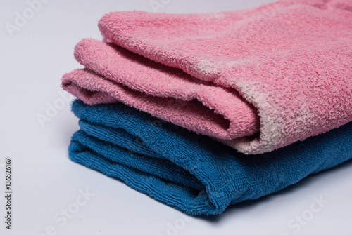Colored towels on white background © vardy