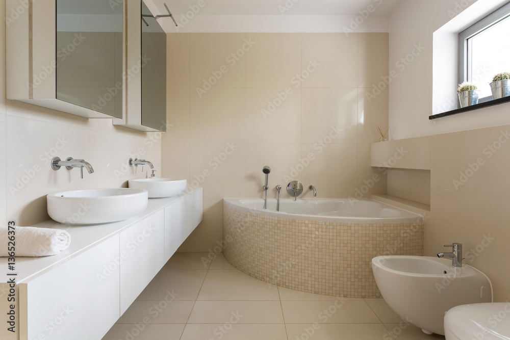 Creamy bathroom with minimalist furniture Creamy bathroom with minimalist furniture