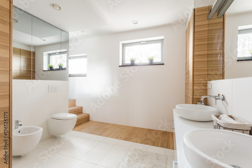 Bathroom with toilet and wide mirrors