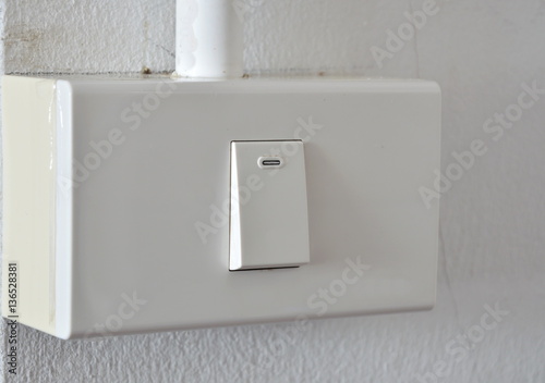 toggle switch in plastic box on the wall © pedphoto36pm