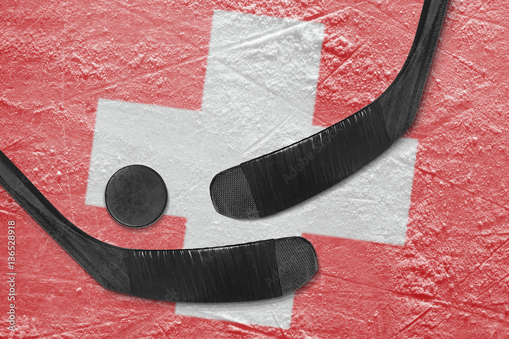 Obraz premium Swiss flag and two hockey sticks hockey