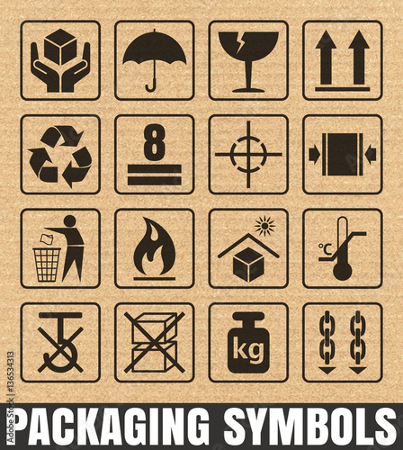 Packaging symbols on cardboard background including Fragile, Handle with care, Keep dry, This side up, Flammable, Recycled, Package weight, Do not litter, Max stack, Clamp and Sling here, and others