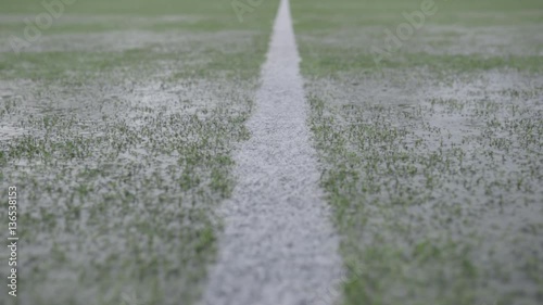 Rain on a soccer camp

Rain shooting of a football field