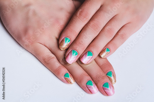 Nail art with bright gold  pink and green chevron pattern