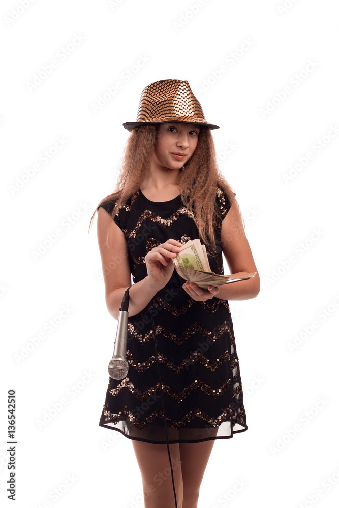 Young girl with long hair wearing a black dress and gold hat with a ...