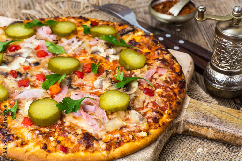Homemade pizza with ham and mushrooms Homemade pizza with ham and mushrooms