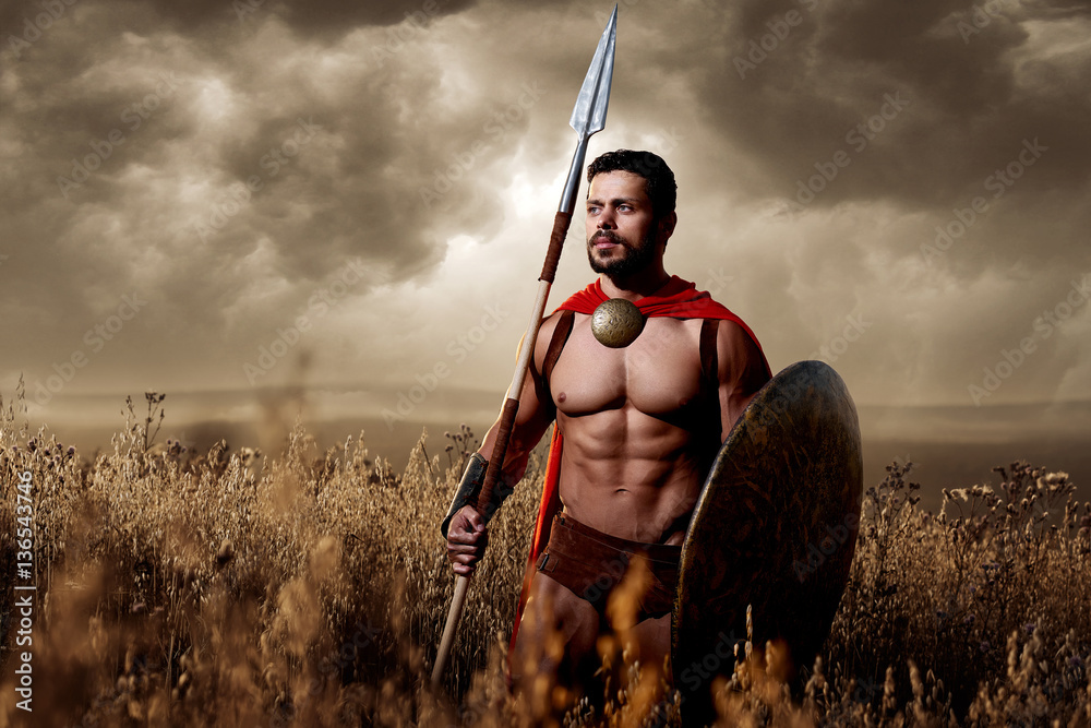 Soldier wearing in armor and loack like spartan. foto de Stock Adobe