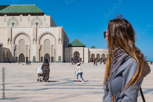 Tourist outside Hassan II Mosque in Casablanca, Morocco.