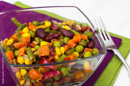 Stewed vegetables in a glass salad bowl