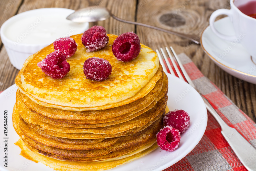Lush and tender Pancake with berries in sugar Lush and tender Pancake with berries in sugar
