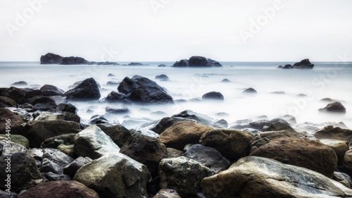 Long exposure of a rocky coast of the Ocean