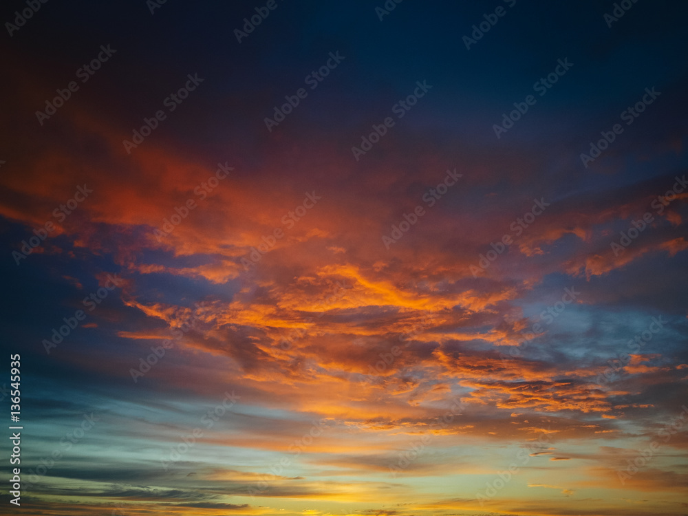 Fototapeta premium Beautiful fiery orange sunset sky