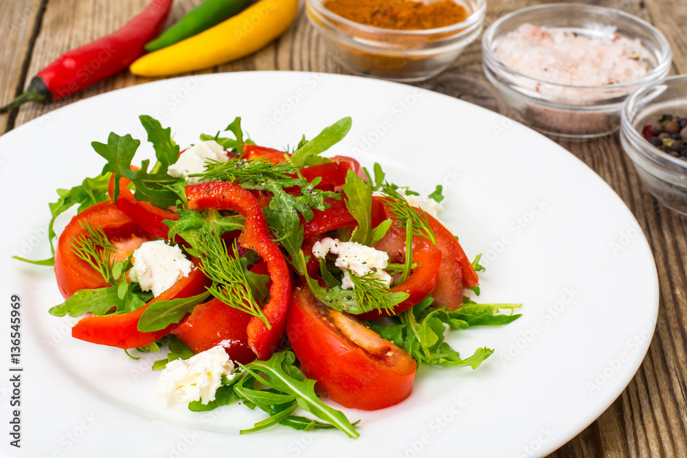 Vegetable salad with arugula and goat cheese