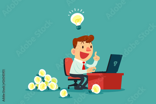 businessman at his desk creating a lot of idea bulbs