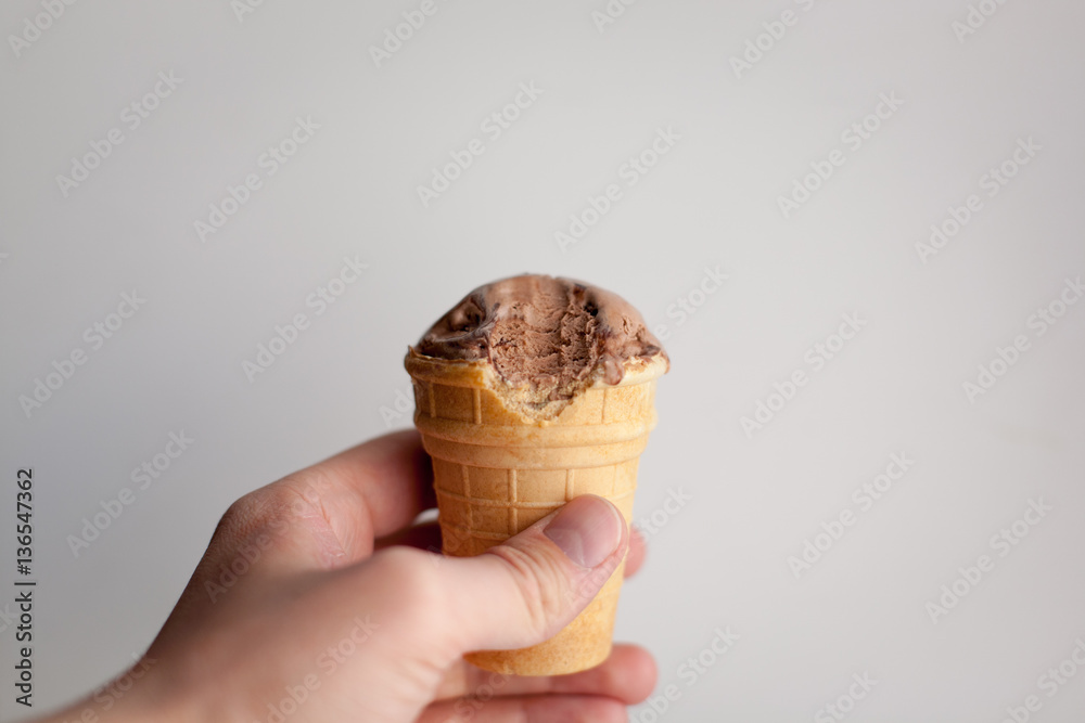 Hand with ice cream waffle cone Hand with ice cream waffle cone