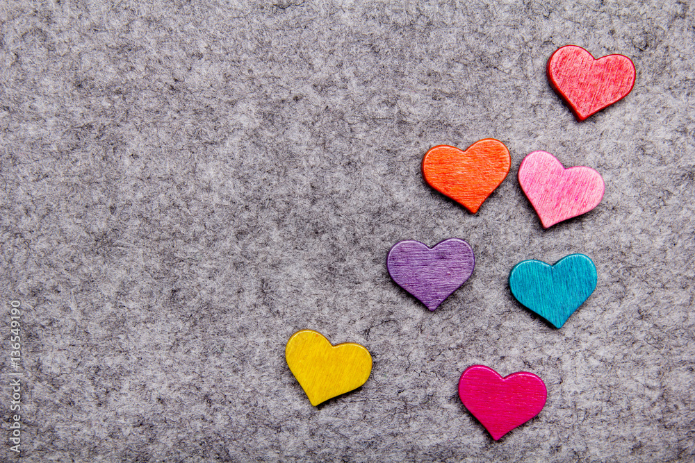 Wooden hearts on gray felt background, copy space Wooden hearts on gray felt background, copy space