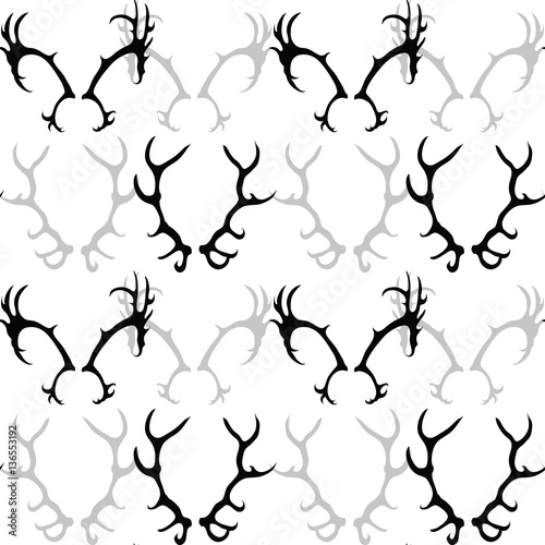 Seamless black and white pattern with silhouette of deer horns. Vector texture for your creativity