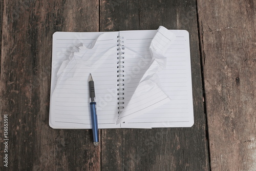 notebook crumpled paper wrinkled blank white on the desk