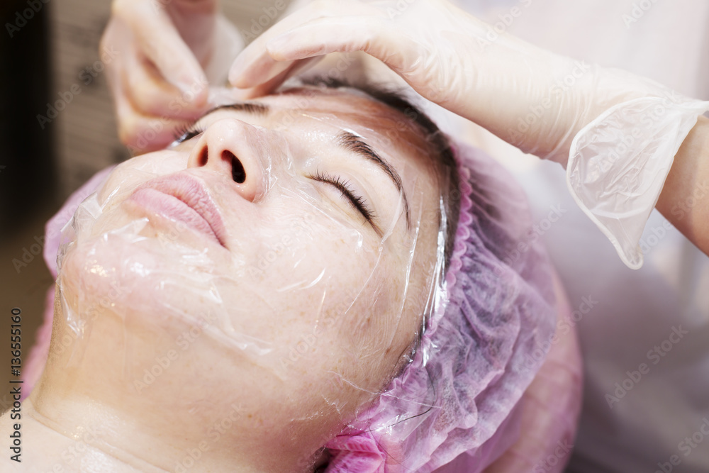 Woman in spa salon receive skin treatment. 
