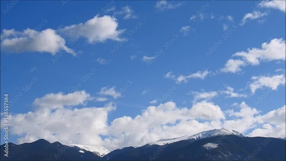 Clouds in the sky above the mountains slowly moving Clouds in the sky above the mountains slowly moving