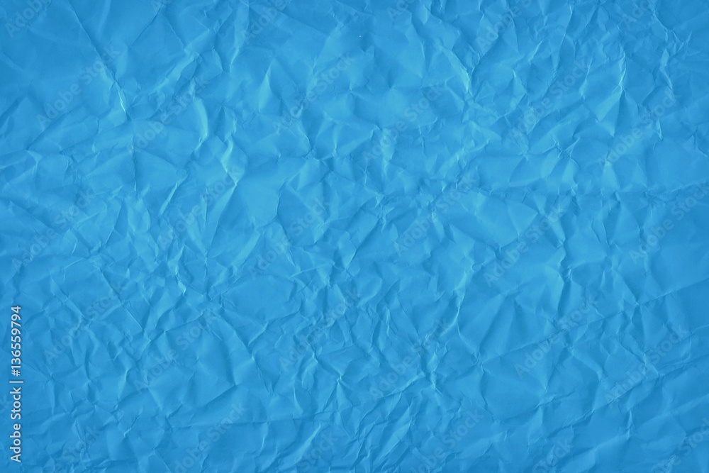 Obraz premium Designed blue background of wrinkled paper