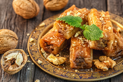 Traditional arabic dessert Baklava with honey and walnuts. photo