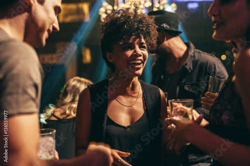 Photography Woman enjoying at nightclub with friends