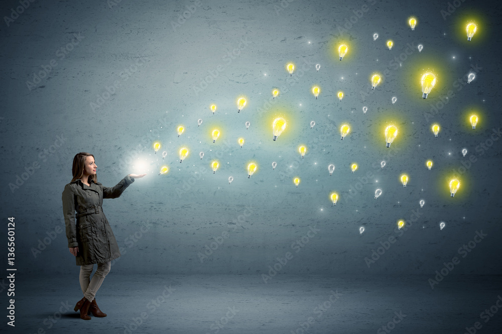 Woman holding lightbulbs Woman holding lightbulbs